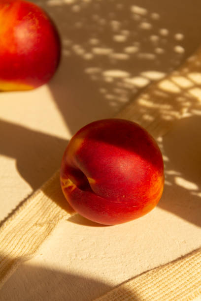 istock Fresh juicy nectarines in a cotton bag on a white background 1275237651