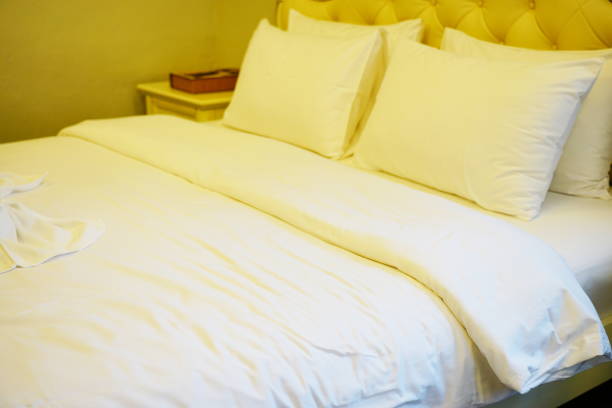 istock Bedroom detail on white bed 1275246454