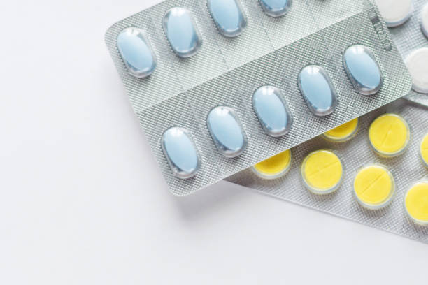 istock Different medicines: tablets, pills in blister pack, medications drugs, macro, selective focus, copy space 1275257640