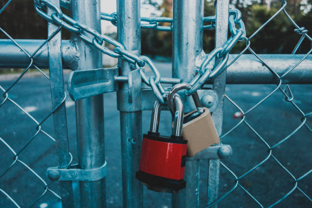 Locked chain link fencing on a construction site.