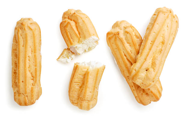istock Set of eclairs whole and half on a white background, isolated. Top view 1275262529