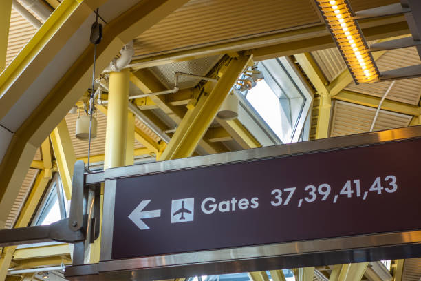 istock Arrival airport gates sign with arrow. 1275266845