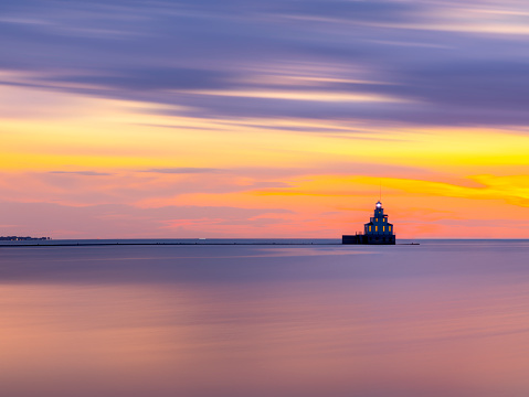 Artistic long exposure at twilight leaves only the lighthouse in focus.