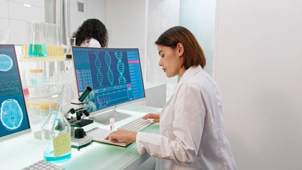 istock Female scientist with microscope. Brainwave scanning research on computer. Camera moving towards 1275317105