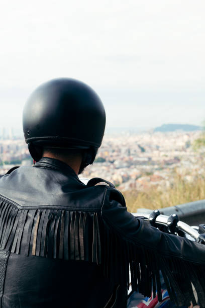 istock back view of an unrecognizable biker with helmet 1275317190