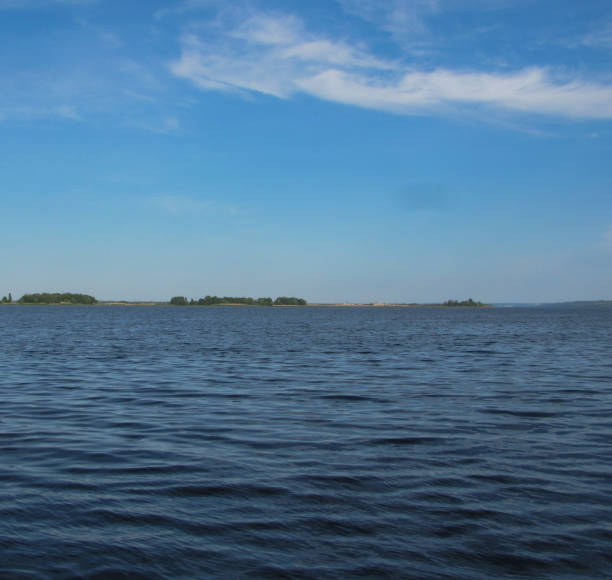 istock large water area with ripples and forest on the horizon 1275317426