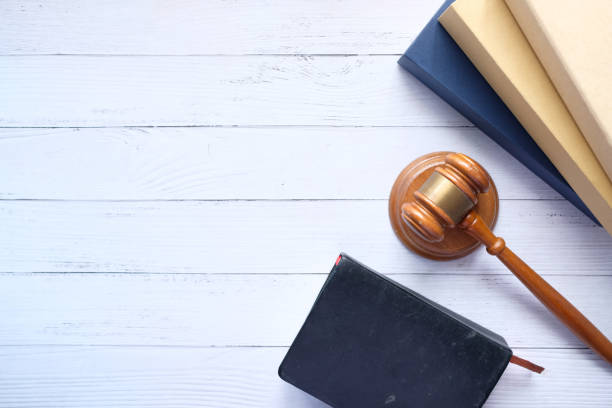 Top view of gavel and book with copy space on table Top view of gavel and book with copy space on table . gavel keyboard stock pictures, royalty-free photos & images