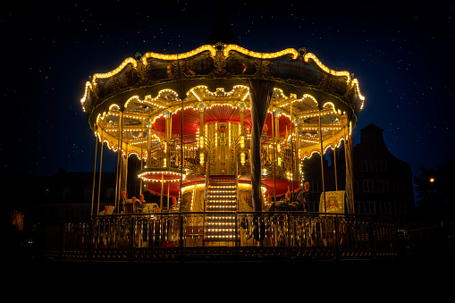 Holidays in Poland - Illuminated vintage XIX-th century carrousel in the Old Town of Gdansk