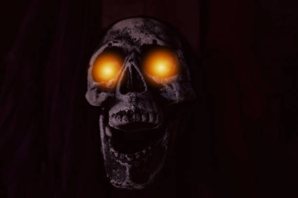 istock Scared scull with burning eyes. Nightmare concept photo. 1275353855