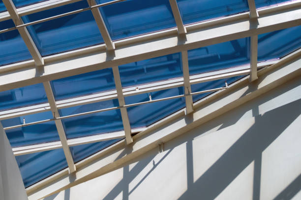 istock Glass roof divided by white metal structures 1275359756