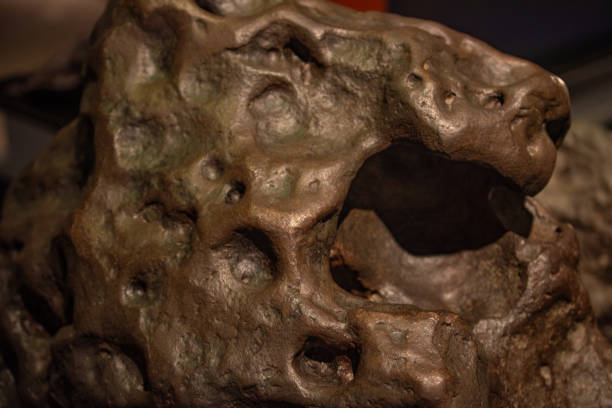 istock Fragment of meteorite, close up. 1275363529