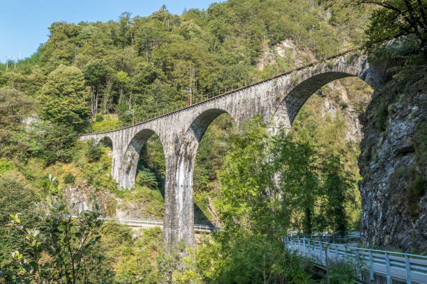 old brick railway bridge in the Centovalli in Switzerland. stock photo