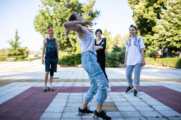 istock Hip hop dancers in a park 1275382922