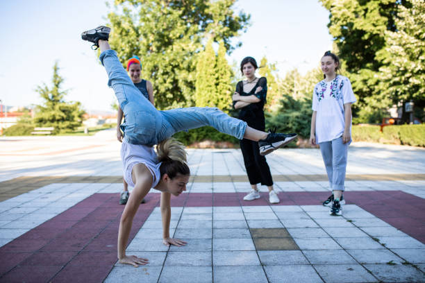 istock A female hip hop dancer in a handstand with split legs 1275383000