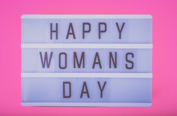 istock Lightbox (letterbox) with Happy Womans day letters on pink background. 1275400041