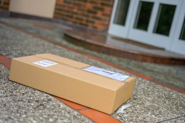 istock Cardboard packages at the doorstep during coronavirus pandemic 1275401610