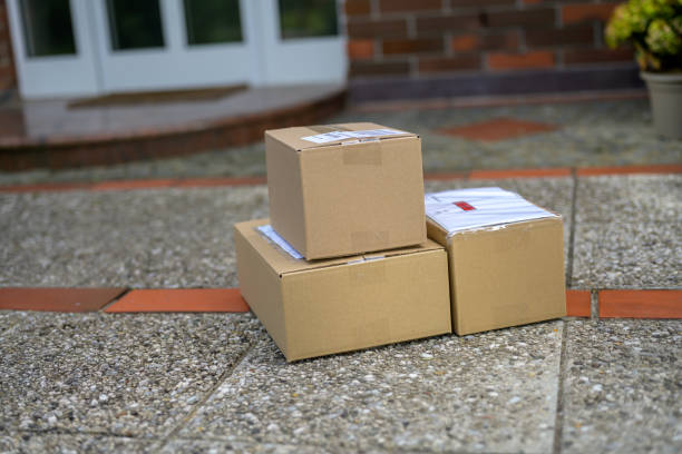 istock Cardboard packages at the doorstep during coronavirus pandemic 1275401651