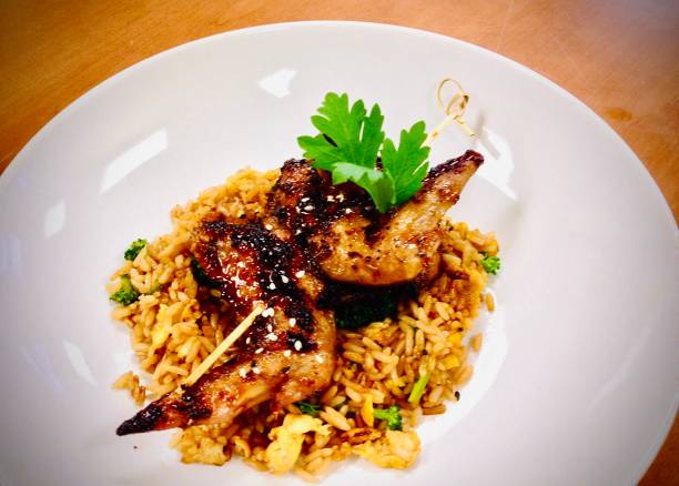 istock North African Spiced Grilled Chicken Wing Satay with Vegetable Fried Rice 1275406251