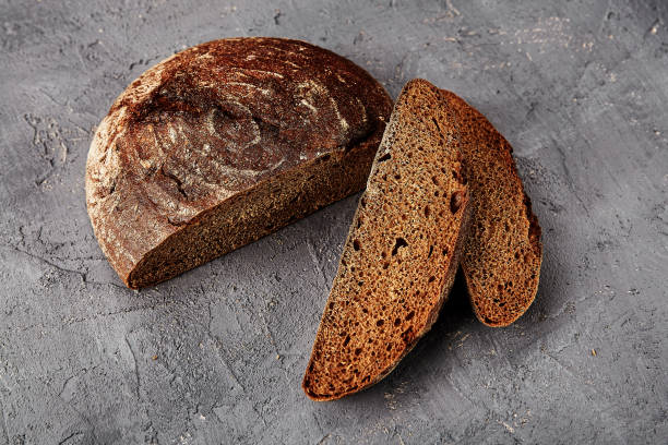 istock Fresh homemade bread on a grey background. Crispbread. 1275414097