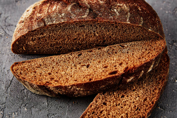 istock Fresh homemade bread on a grey background. Crispbread. 1275414602