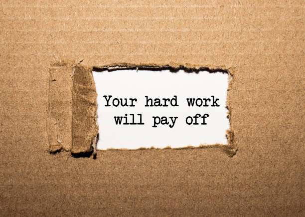 istock The text Your hard work will pay off behind torn brown paper 1275425441