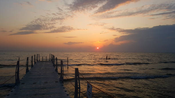 istock Small sea pier at sunset. 1275430972