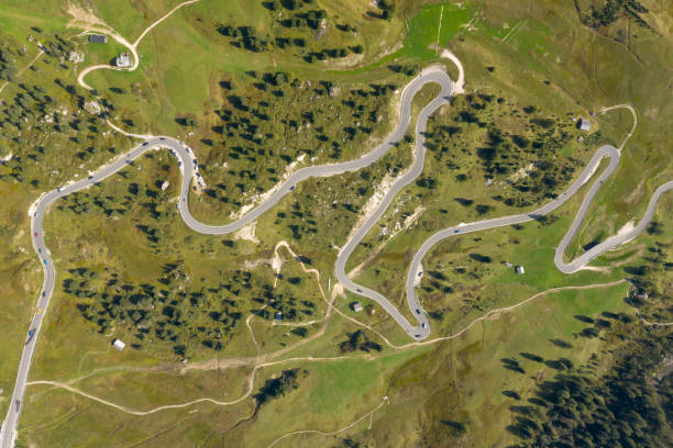 Aerial of the famous Gardena Pass, a high mountain pass in the Dolomites of the South Tyrol in northeast Italy. At an elevation of 2,136 m above sea level, the pass connects Sëlva in the Val Gardena on the west side with Corvara in the Val Badia. Converted from RAW.
