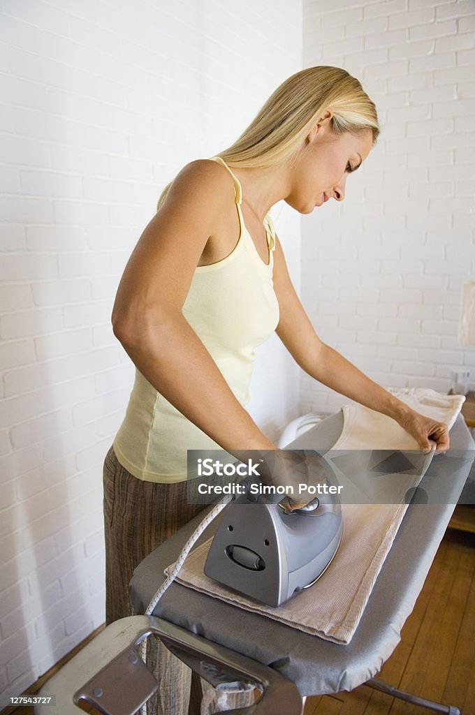 Woman ironing pants  30-34 Years Stock Photo