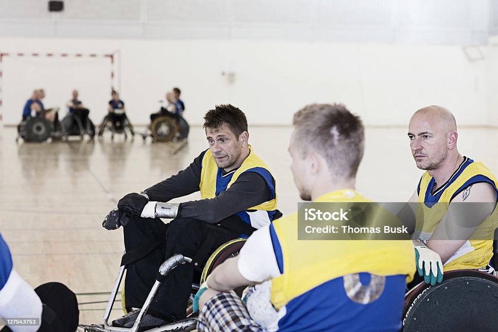 Para rugby team talking during time-out  Wheelchair Rugby Stock Photo