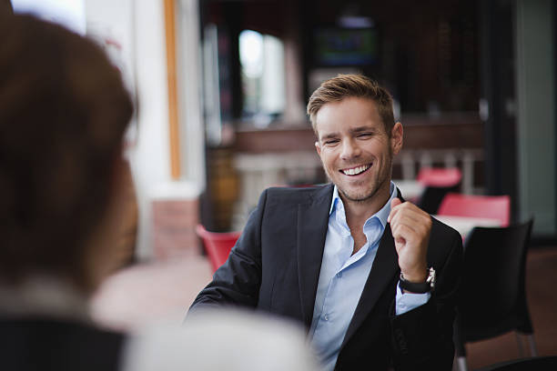 Businessman laughing at lunch  business lunch stock pictures, royalty-free photos & images