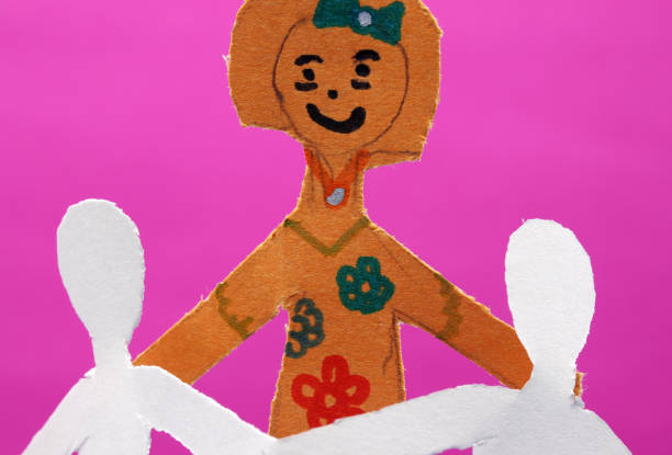 paper people holding hands together
