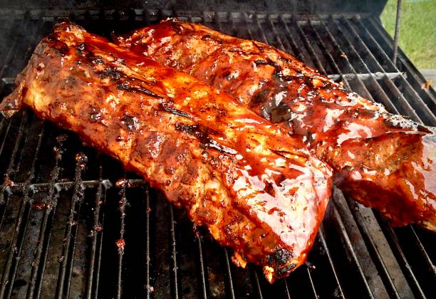 Wine Country Agave Blackberry Glazed Ribs Pork ribs slow smoked for 8 hours and glazed with an agave blackberry glaze barbecue pork stock pictures, royalty-free photos & images