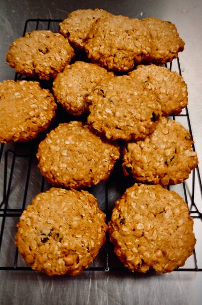 istock Freshly Baked Oatmeal Raisin Cookies on a Cooling Rack 1275456505