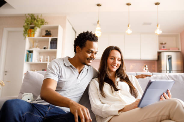 istock Couple booking the trip together on digital tablet 1275501440