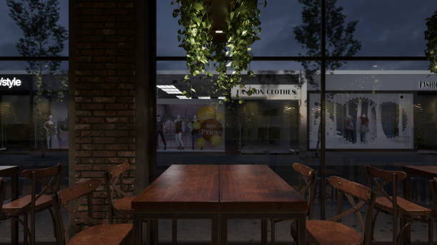 istock Empty Table and Chairs by the Window Inside a Roadside Restaurant After the Sunset 1275515235
