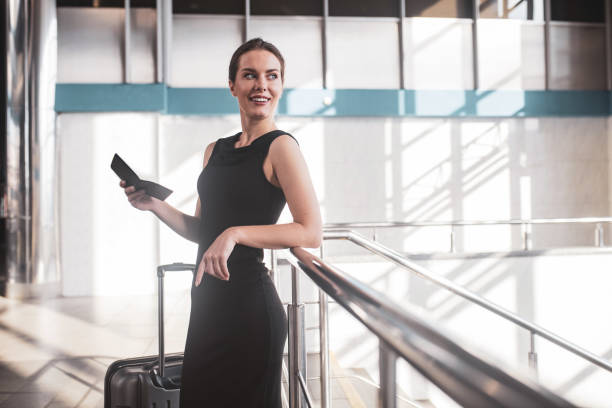 istock Elegant woman preparing to take a train 1275517210