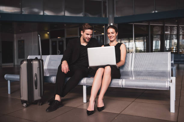 istock Colleagues completing a working task together in the airport 1275518912