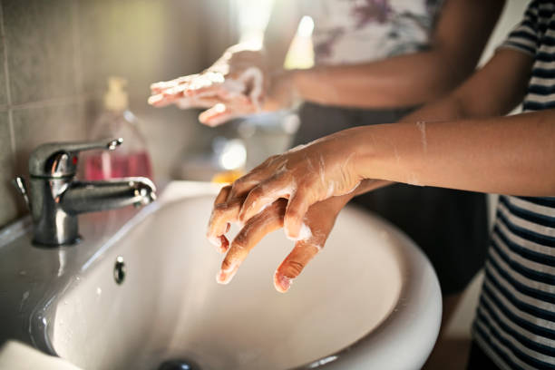 istock Brother and sister washing hands thoroughly 1275521378