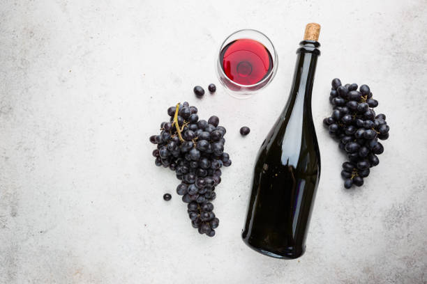 istock Red wine and ripe grapes 1275539938