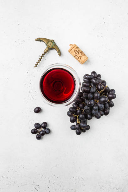 istock Red wine and ripe grapes 1275541443