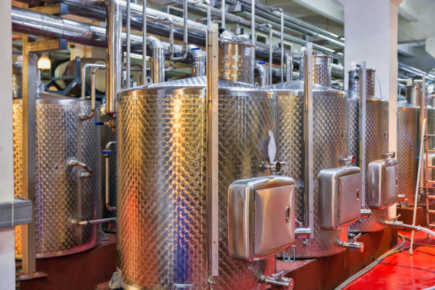 istock Stainless steel reservoirs for wine at modern winery. 1275542414