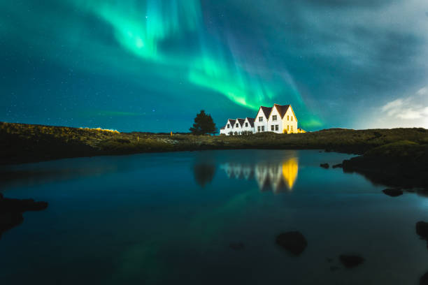 Lonely houses under northern lights, Keflavik, Iceland Lonely houses under northern lights, Keflavik, Iceland. High quality photo geomagnetic storm photos stock pictures, royalty-free photos & images