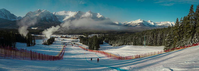 Panoramic view of the finish area in Lake louise ski resort with canadian rockies in the background. Winter fairytale setting