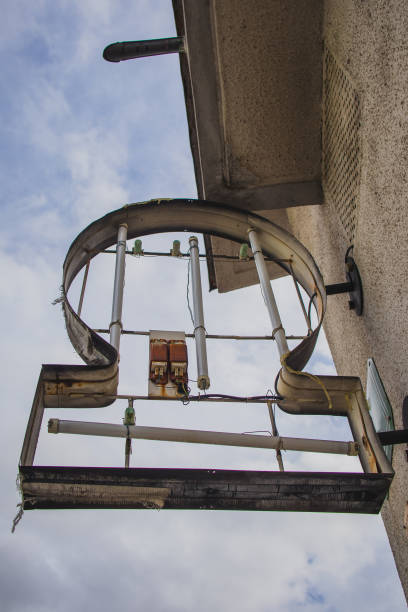 istock Destroyed neon sign mounted on a wall 1275604584