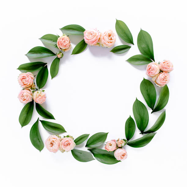 istock Round frame with pink flower buds, branches and leaves isolated on white background. lay flat, top view 1275604633