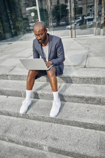 istock Attentive international freelancer working at his project outdoors 1275616534