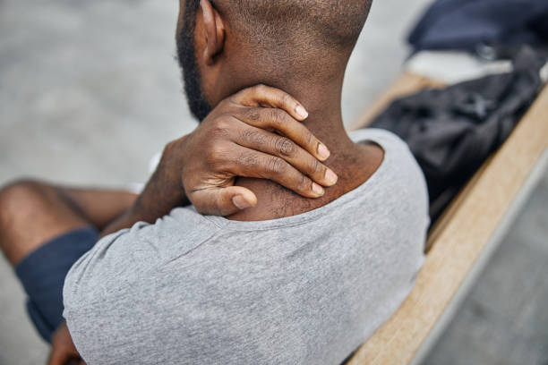 istock Focused photo on male hand that touching neck 1275620359