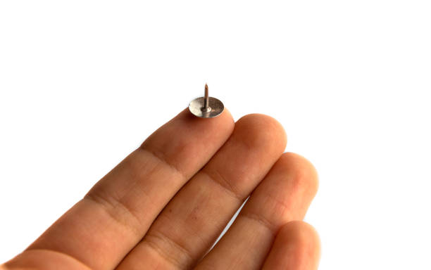istock Sharp steel pin on the index finger in the hand 1275636188