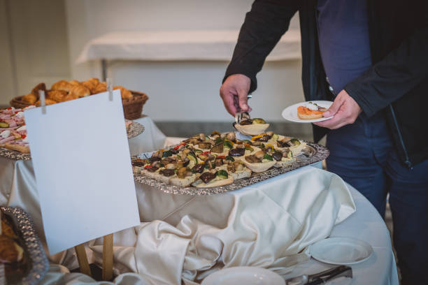 istock Man taking a catering sandwich 1275638233