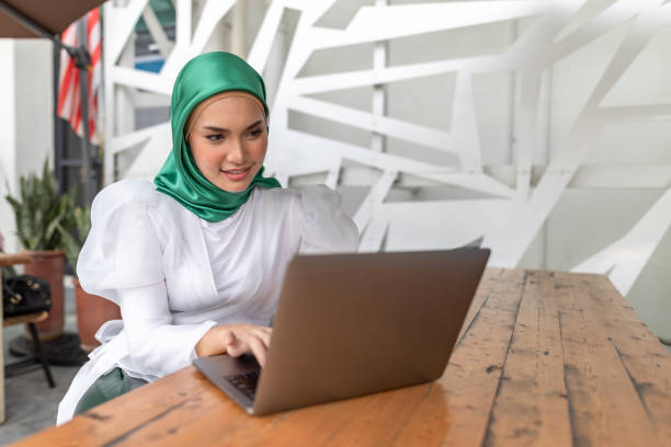 istock Asian women with smartphone and laptop 1275667801